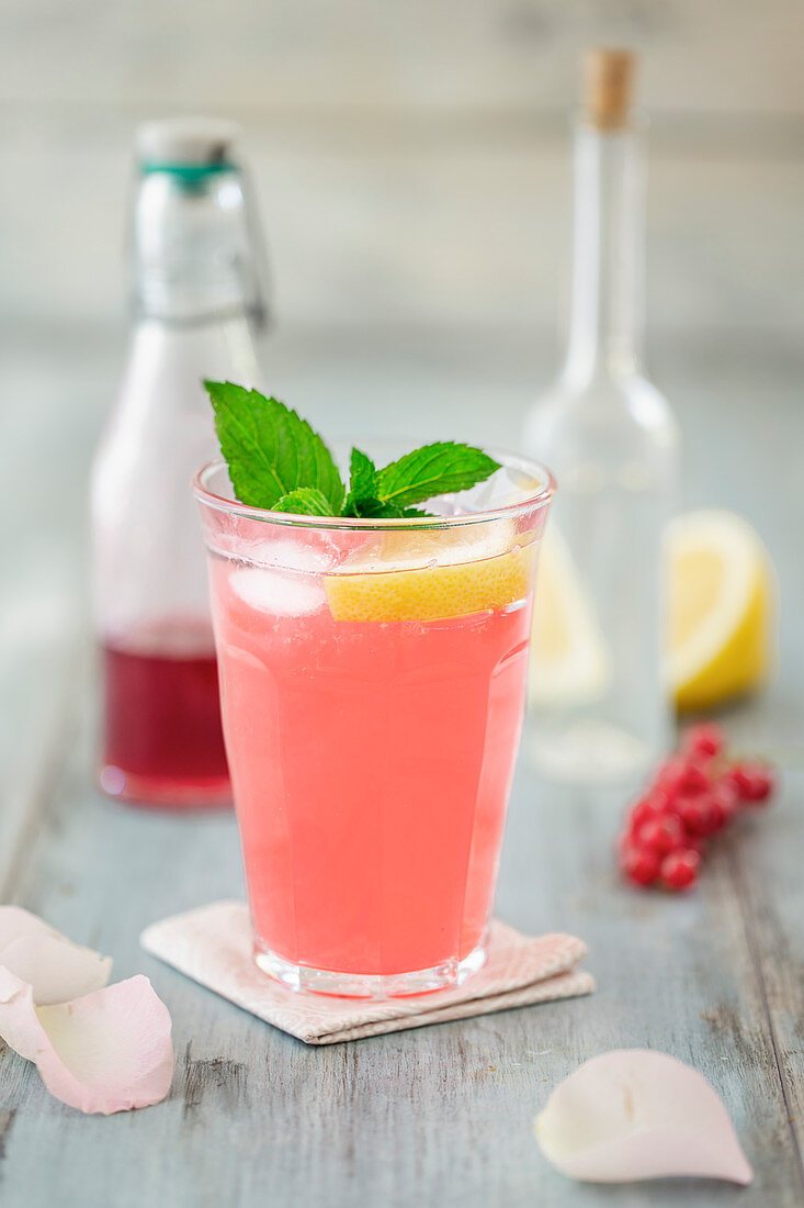 Sharbat (Persian lemonade) with redcurrant syrup, lemon and rose water