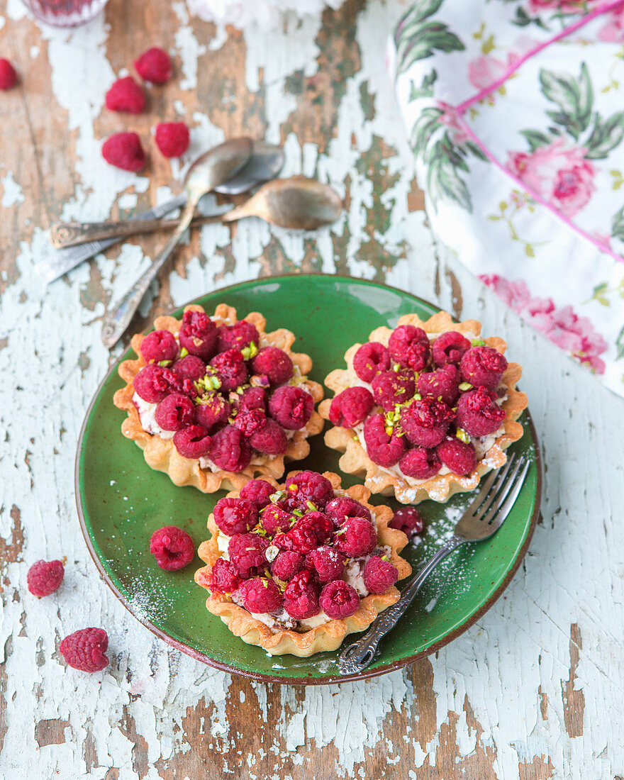 Raspberry pistachio tarts