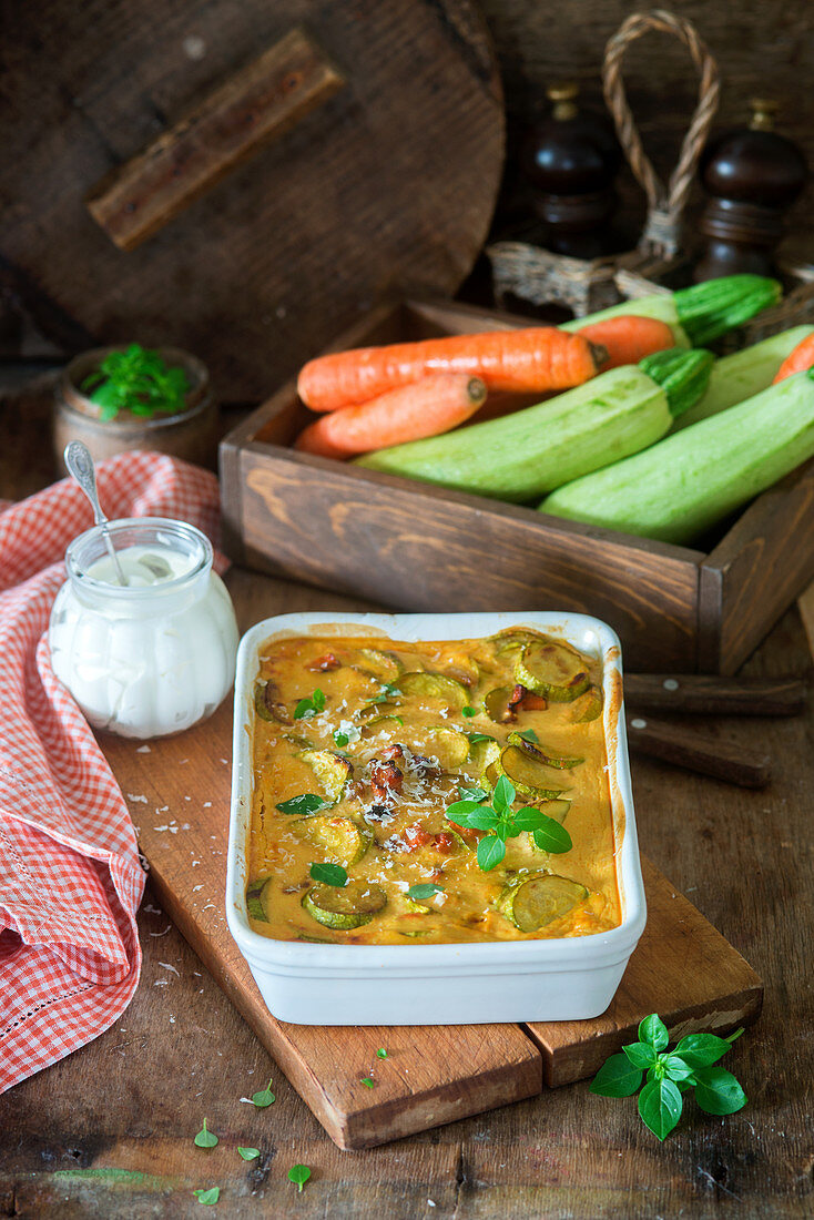 A vegetable casserole with zucchini, carrots, eggs and cheese