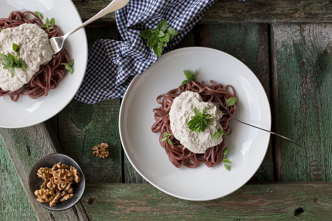 Red wine pasta with ricotta and walnut sauce