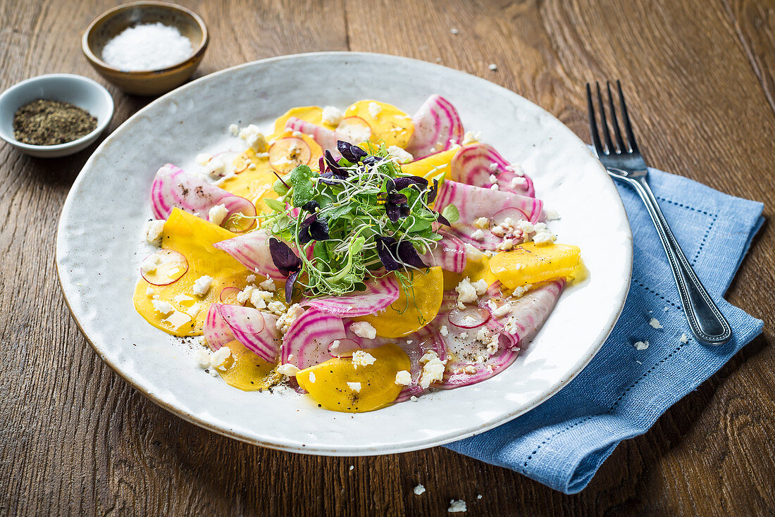 Salad with golden beets, chioggia beets, feta cheese, radishes and fresh herbs