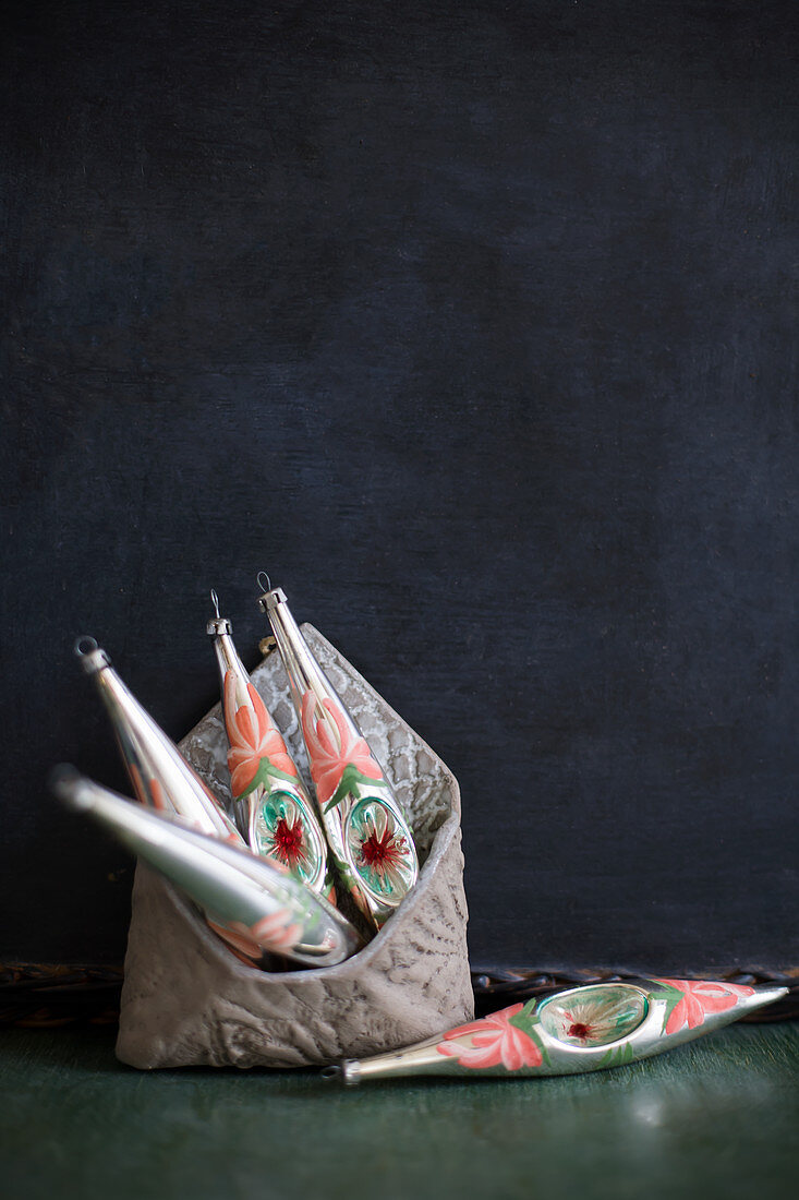 Christmas decorations in purse against black background