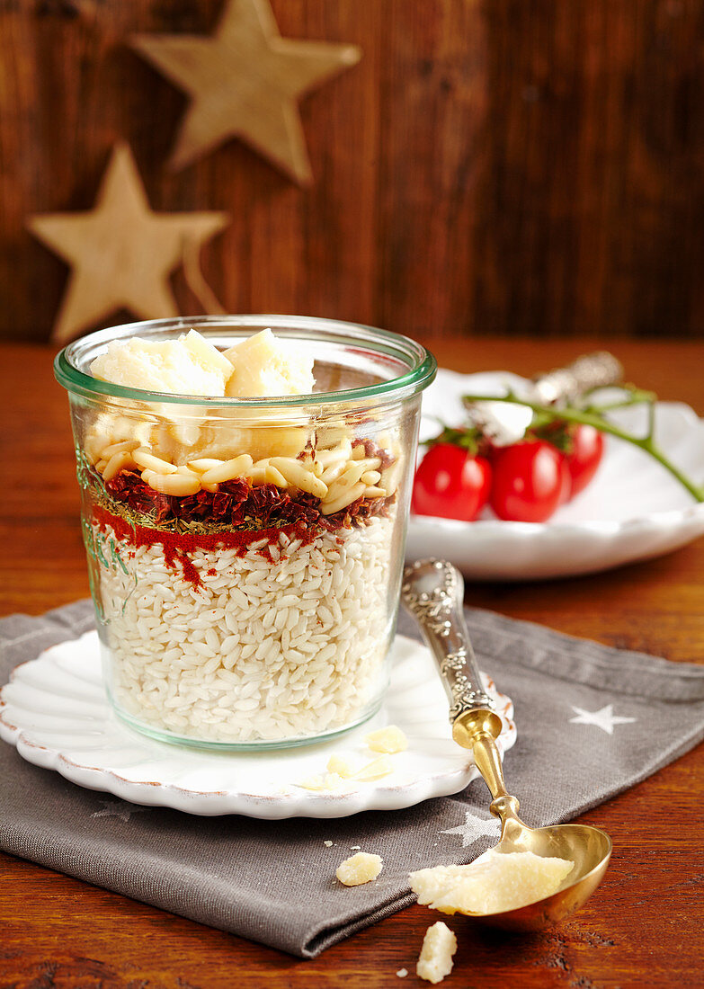 Risotto mix with pine nuts and dried tomatoes in a glass