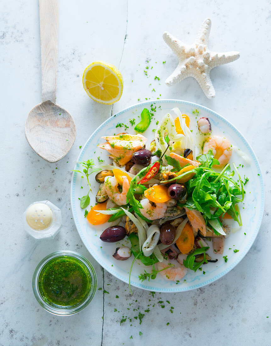 Seafood salad with olives and a herb dressing