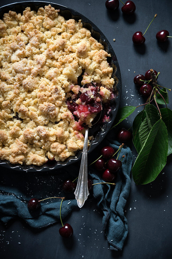 Vegan coconut crumble with sweet cherries and apples