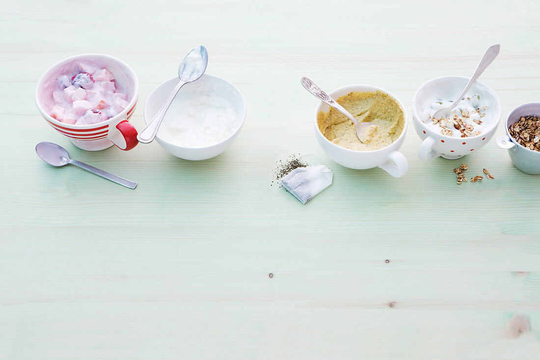 Cherry quark with melon, pear and buttermilk quark, mango and mint cream and crispy flakes with grape cream