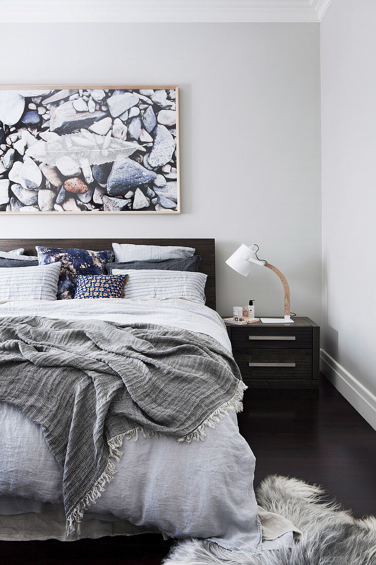 Bedroom in shades of gray with natural decoration