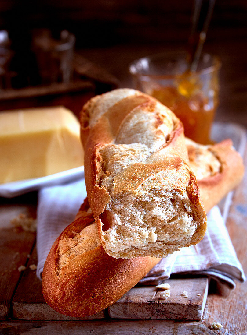 A fresh baguette with butter and jam