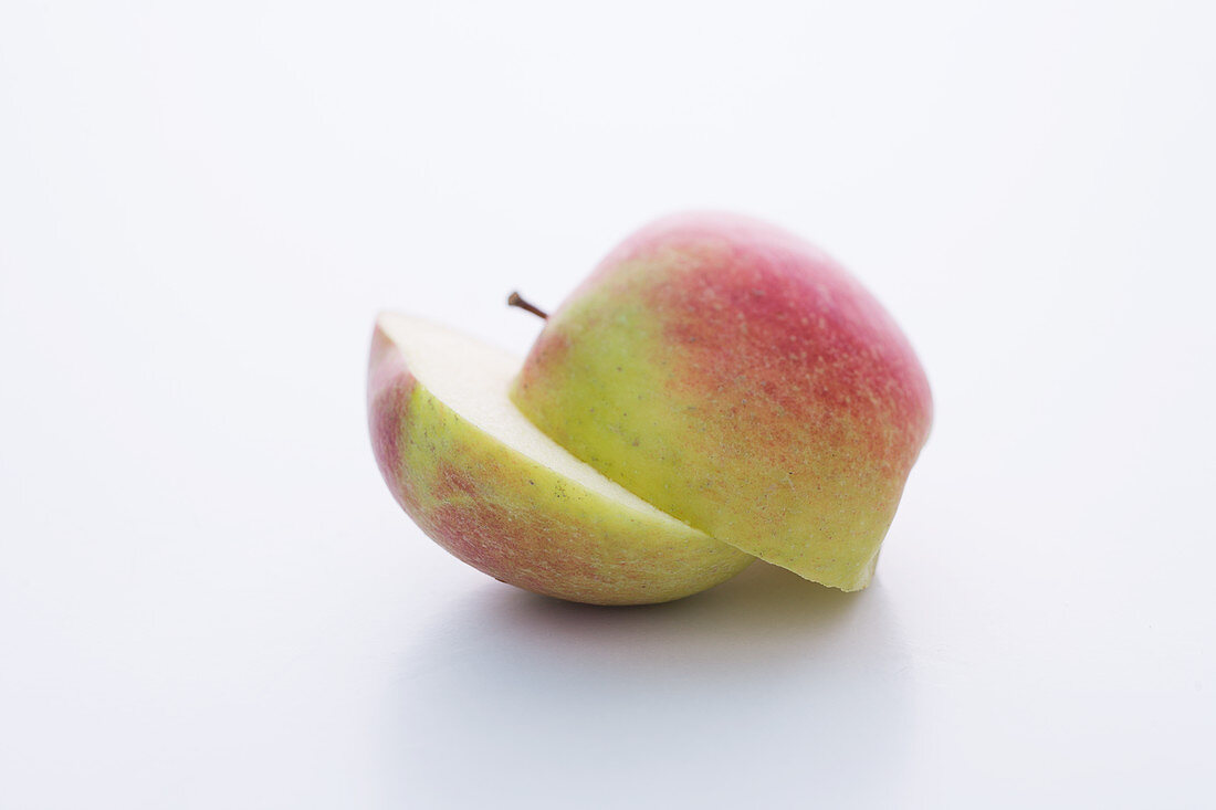 A Braeburn apple, halved
