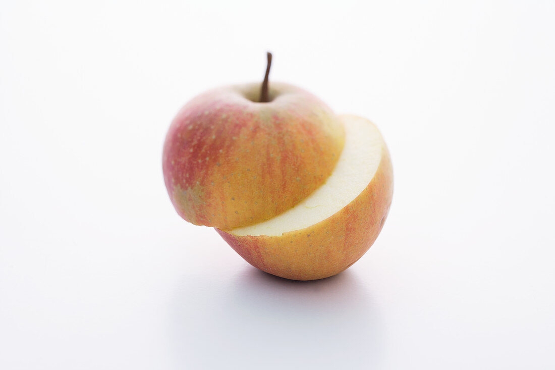 A Rubinette apple, halved