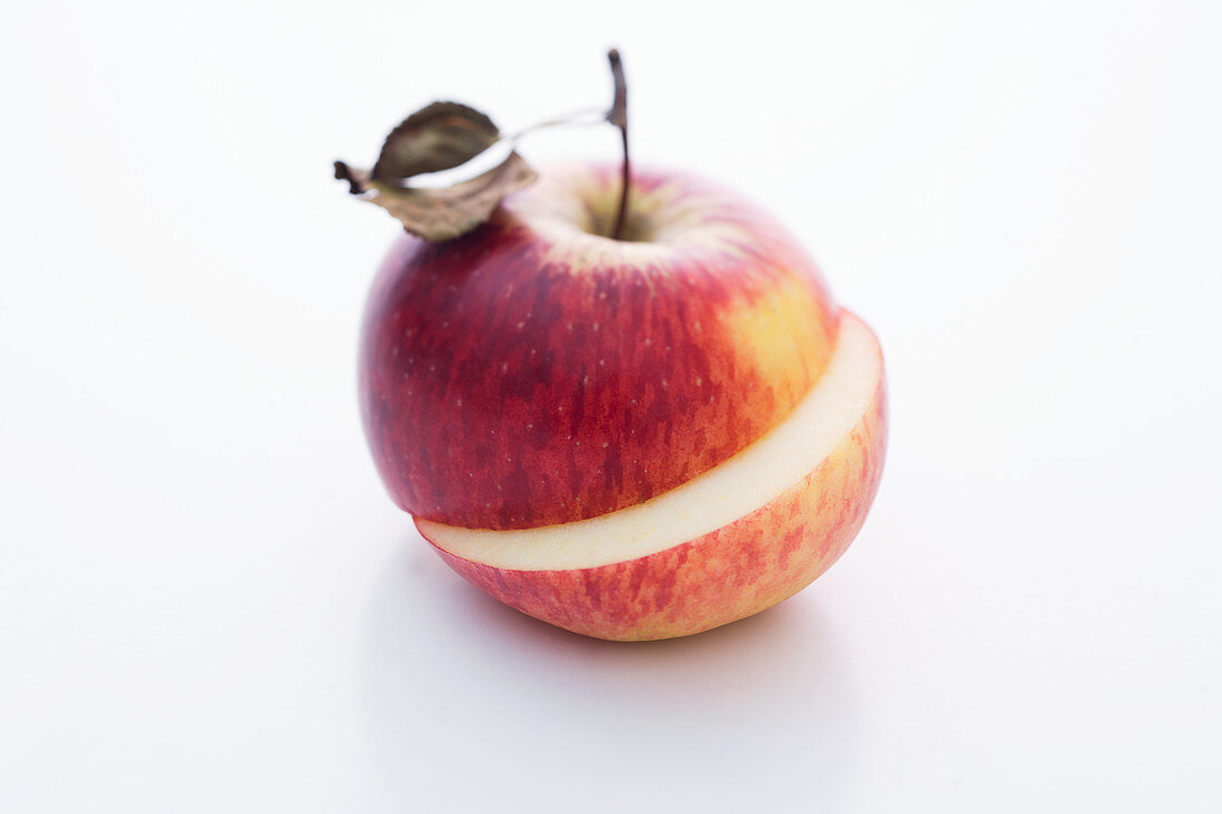 A Rubinola apple, halved