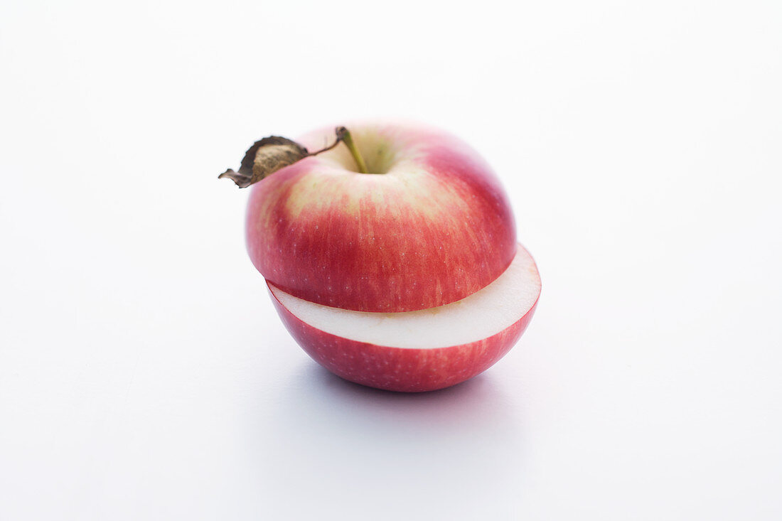 A Spartan apple, halved