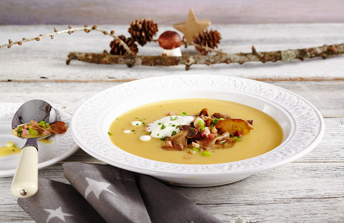 Potato soup with fried porccini mushrooms, bacon and cream