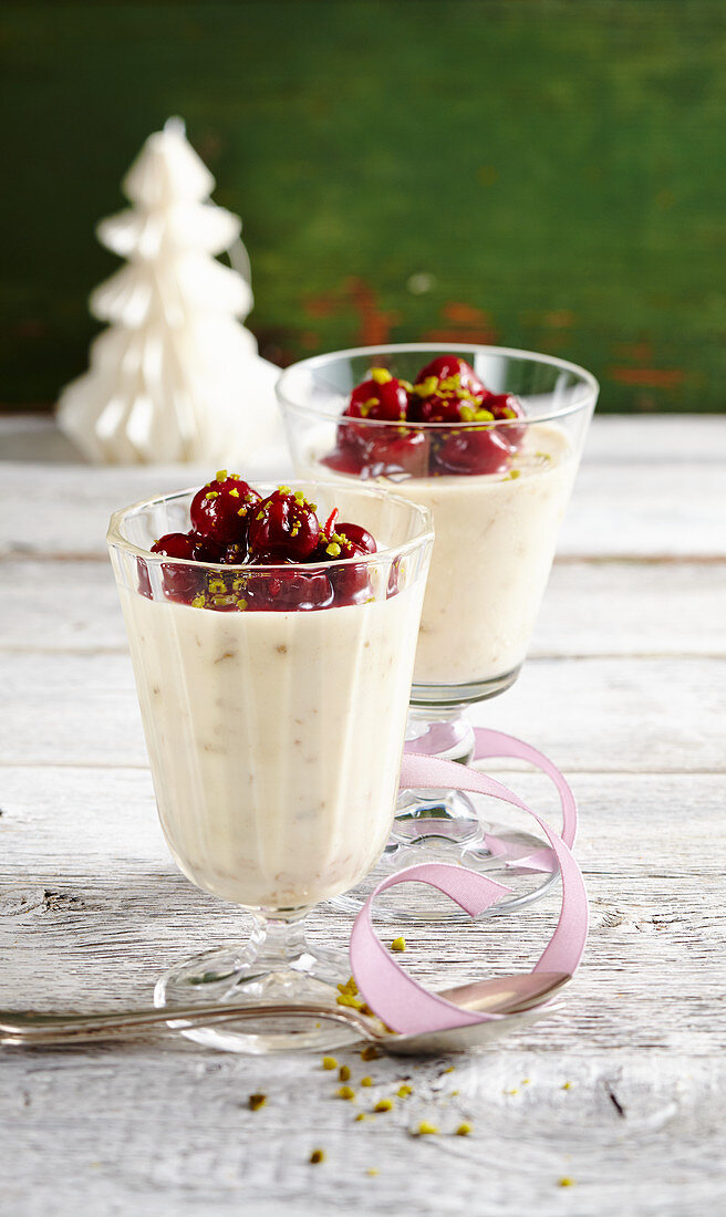 Gingerbread cream with red wine punch cherries in glasses