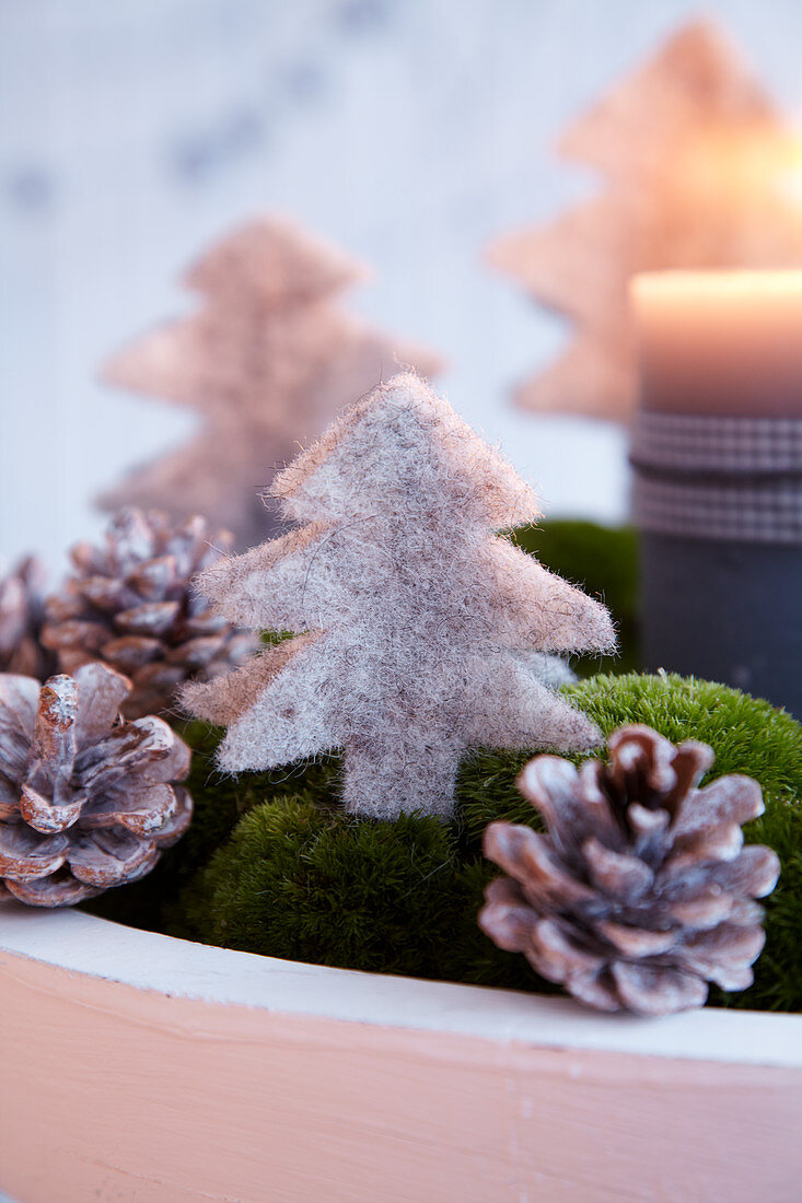Moss Advent wreath decorated with felt Christmas trees and pine cones (detail)