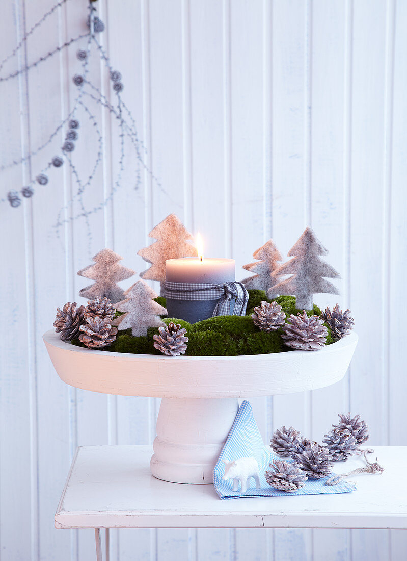 Moss Advent wreath decorated with felt Christmas trees and pine cones