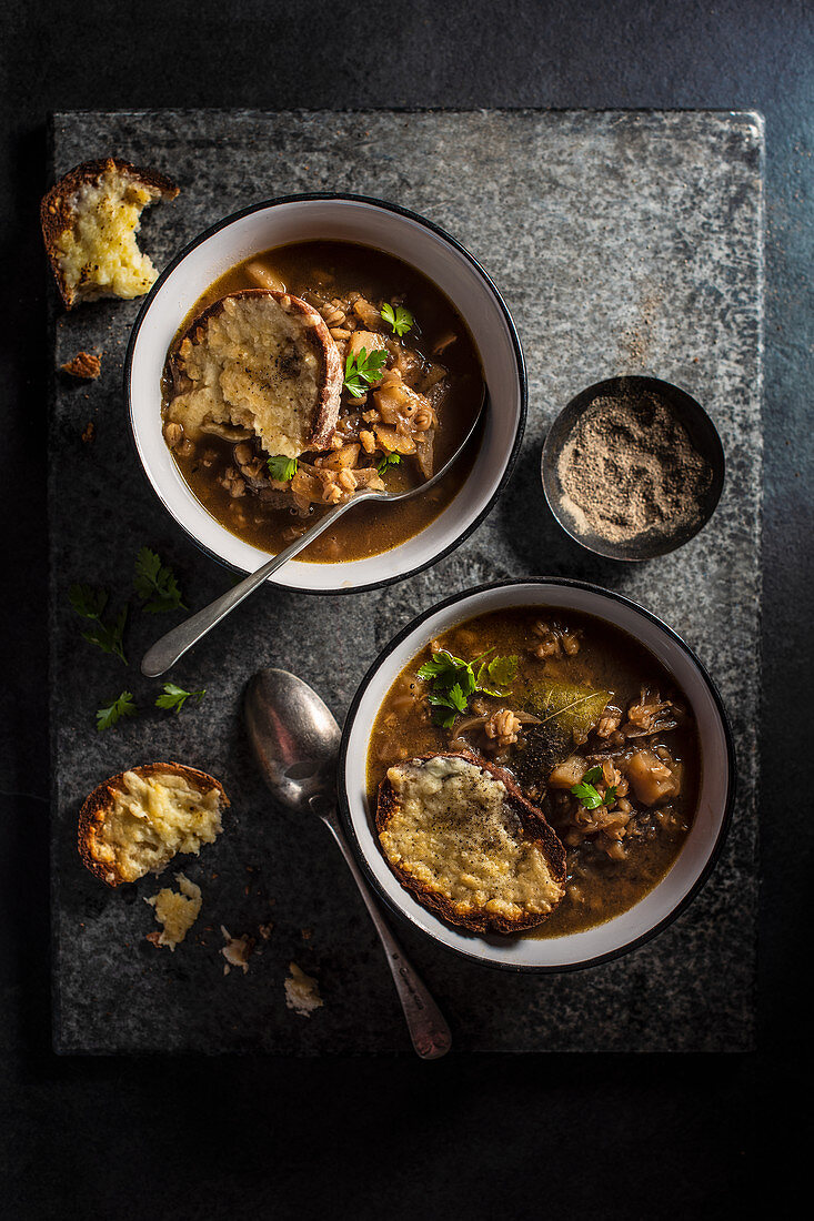 Onion and barley soup with cheese toasted bread