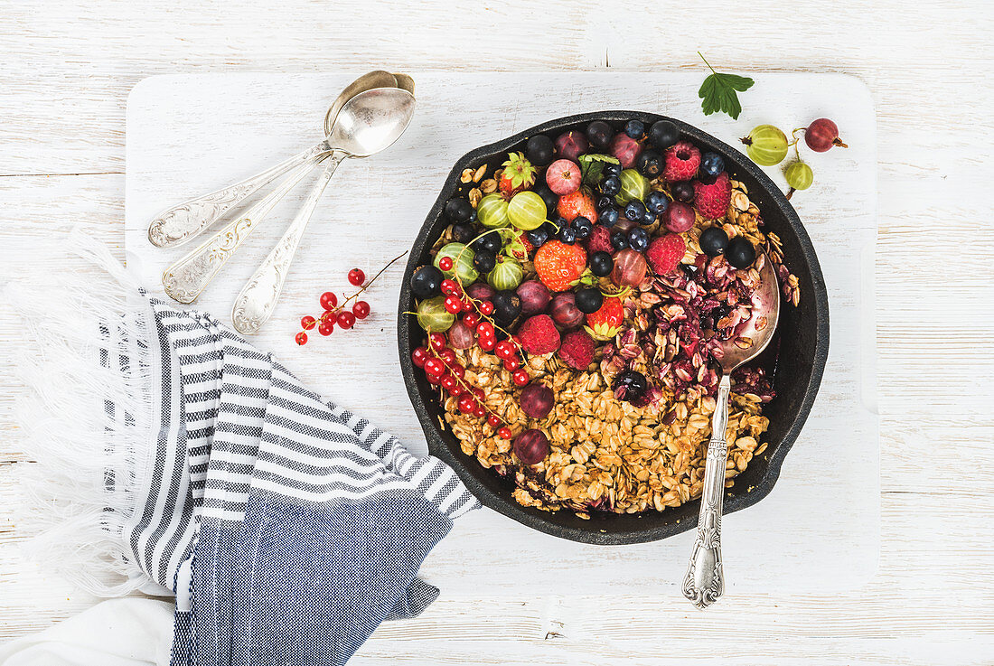 Healthy breakfast - Oat granola crumble with fresh berries and seeds