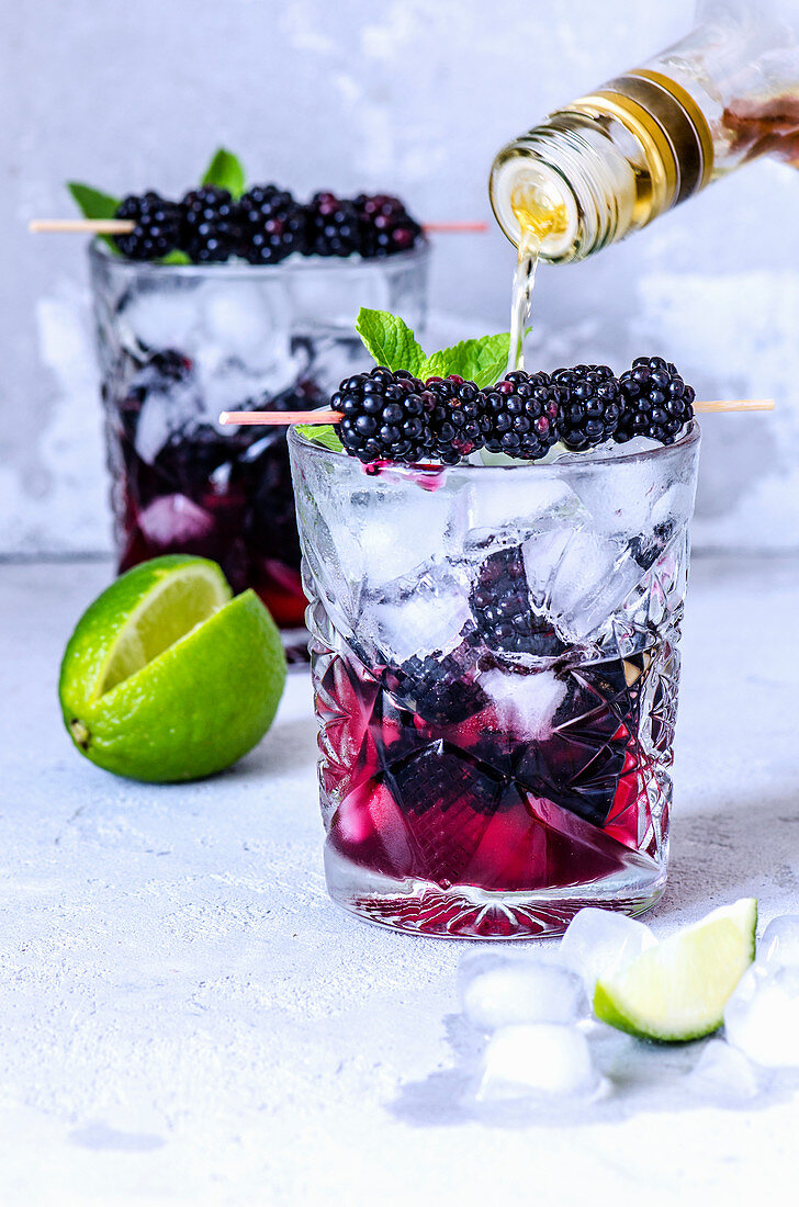 Refreshing summer cocktail with blackberries and rum