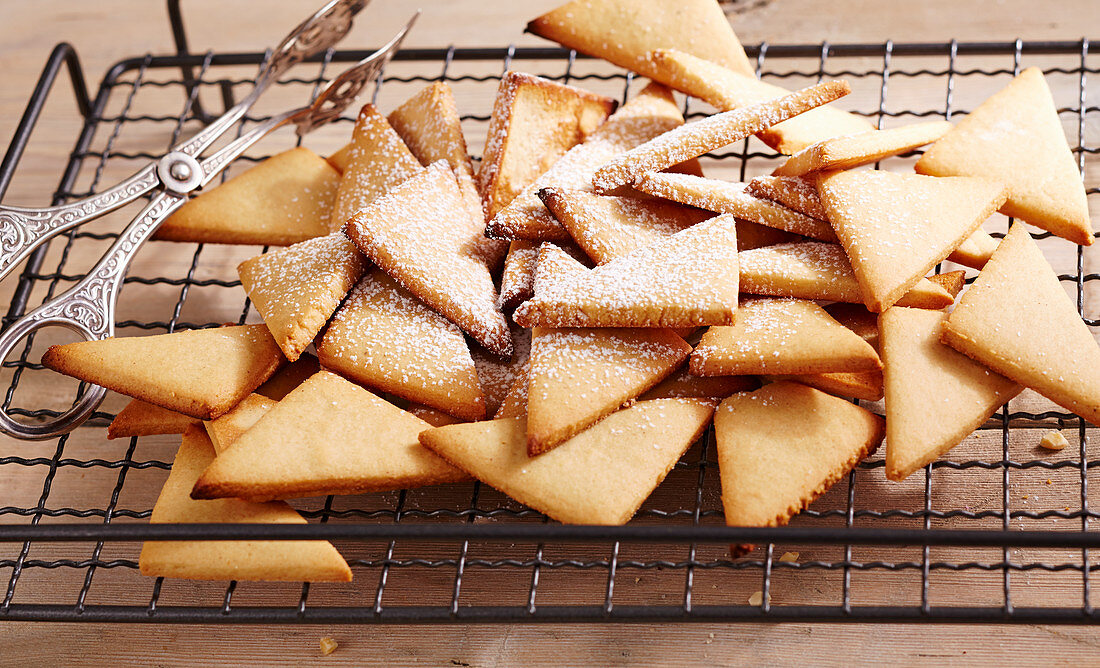 Honey triangle biscuits on a wire rack