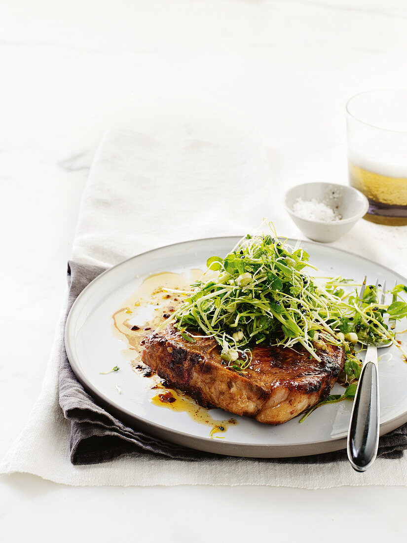 Sticky pork chops with horseradish sprout slaw