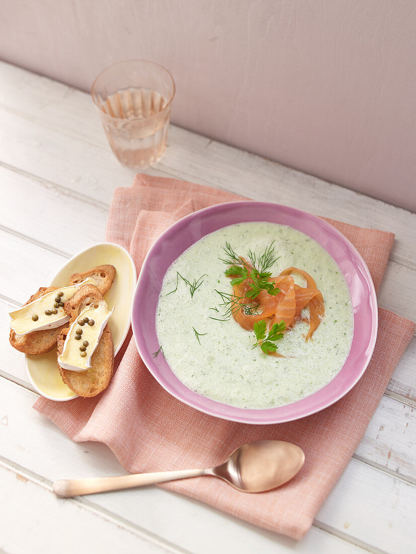 Cold cucumber soup with smoked salmon and crostini with pepper cheese