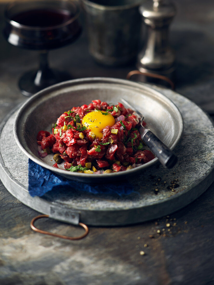 Beef tartar with an egg yolk