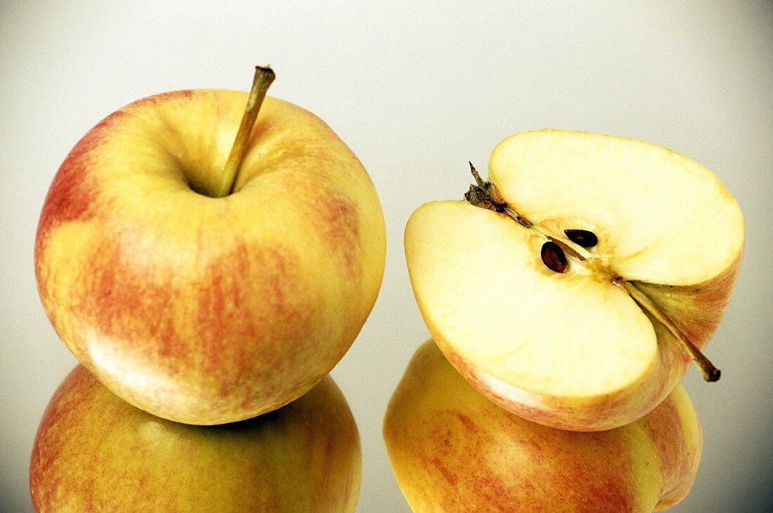 A Whole Cox Orange Apple with Half a Cox Orange Apple