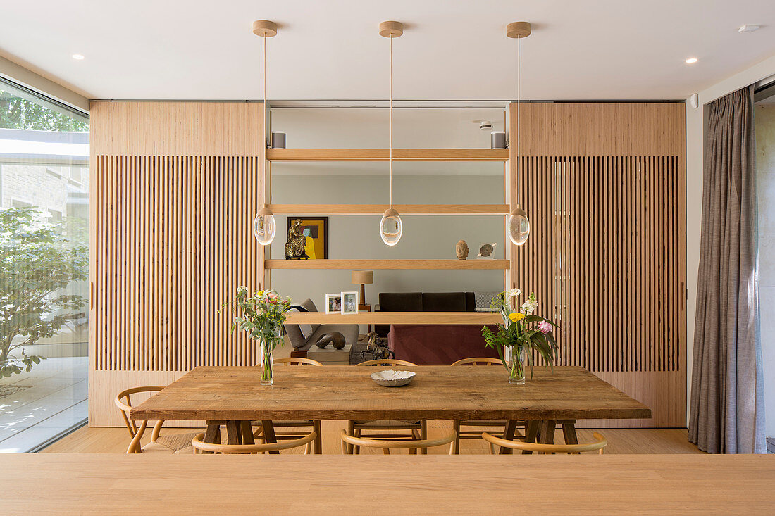 Dining area with view of lounge through open partition