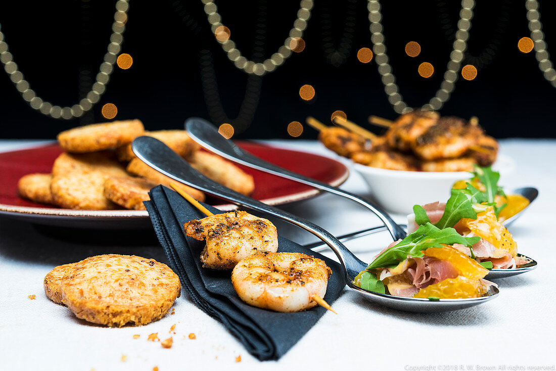 Prawn skewers with clementine salad, prosciutto and parmesan shortbreads