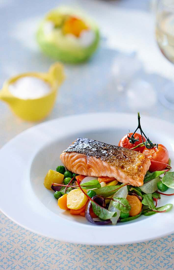 Salmon fillet on a bed of vegetables