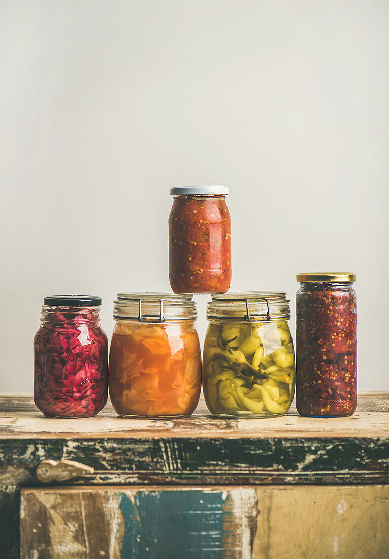 Autumn seasonal pickled or fermented colorful vegetables in jars