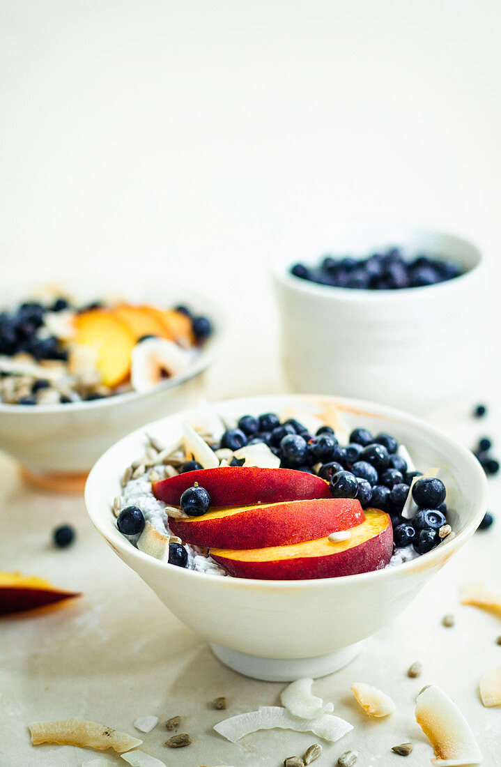Chia pudding with nectarines, blueberries, and coconut flakes