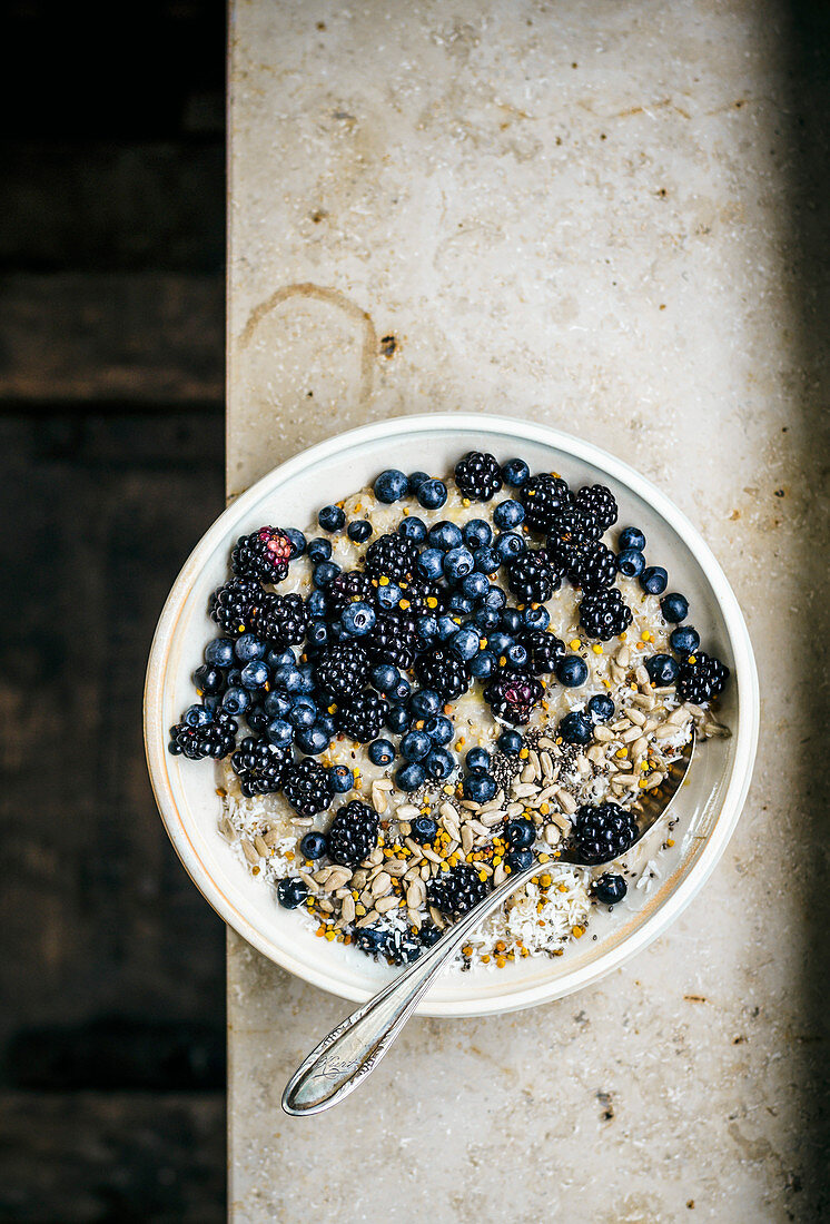 Porridge with berries, seeds, and bee pollen