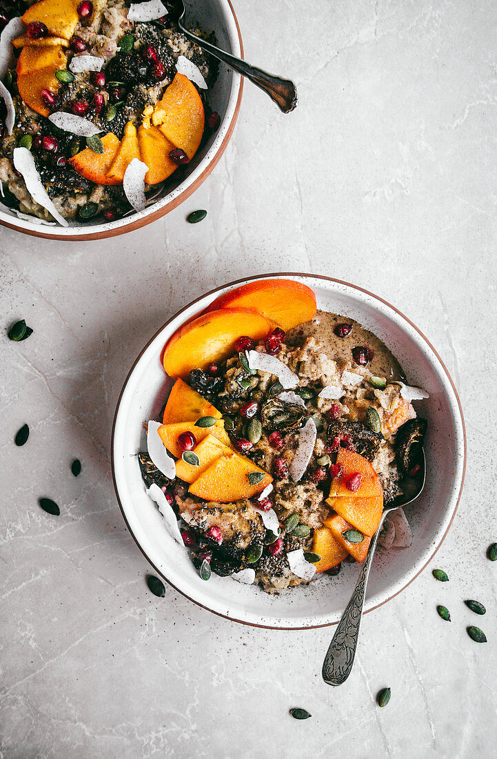 Persimmon porridge with pomegranate, coconut, and seeds