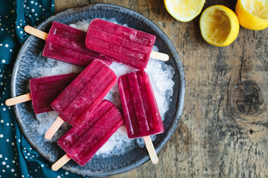 Red popsicles on ice