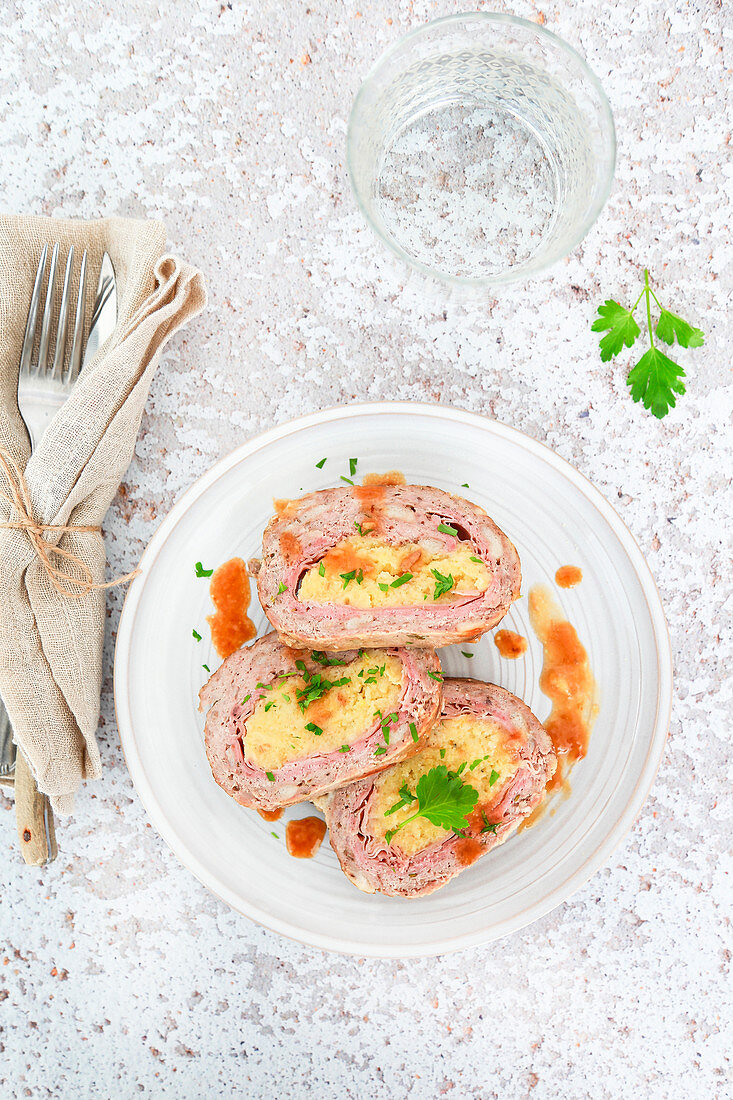 White meatloaf stuffed with ham and mashed potatoes