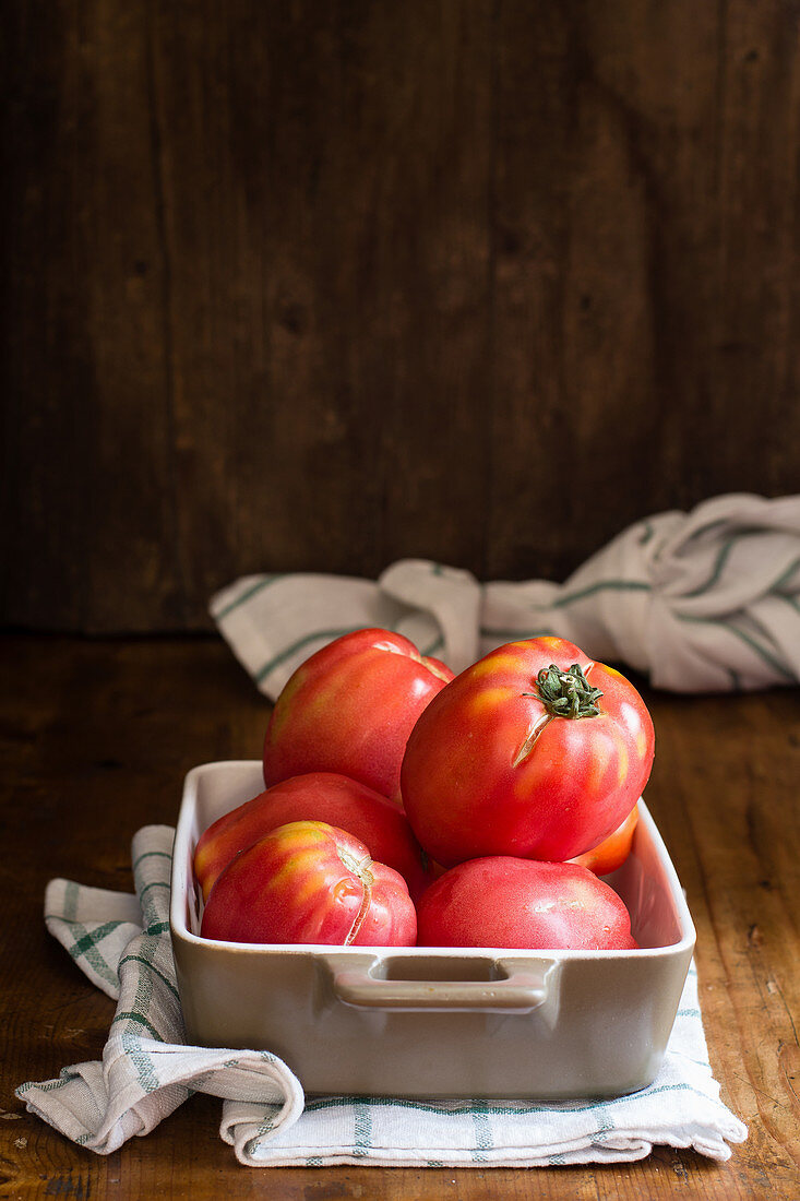 Fresh tomatoes in a baking dish