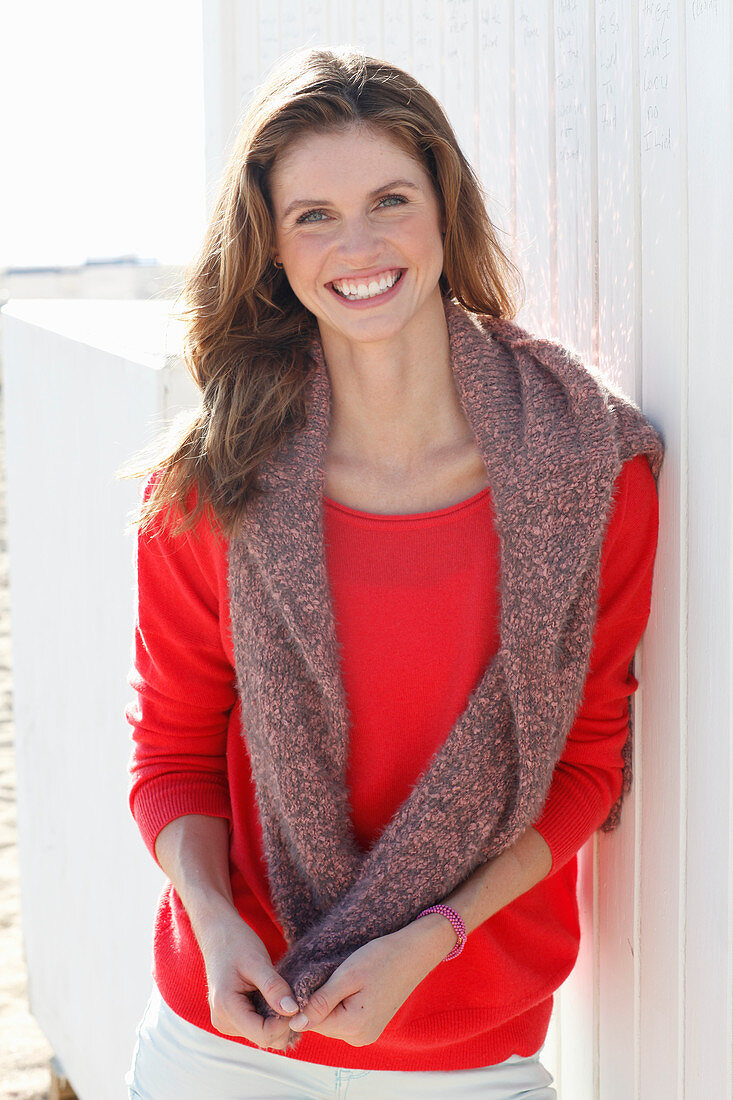 A young woman wearing a red jumper