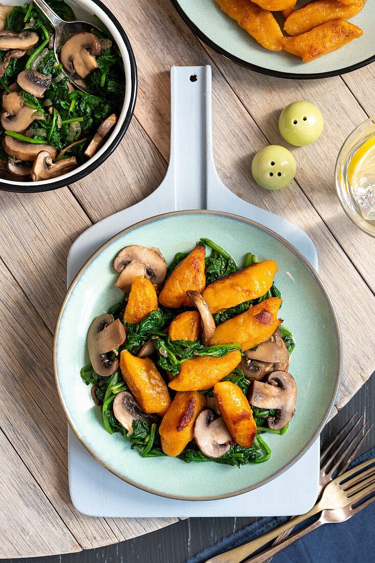 Sweet potato gnocci with spinach and mushrooms vegan dish