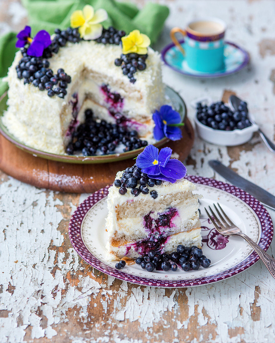 A white chocolate and blueberry cake