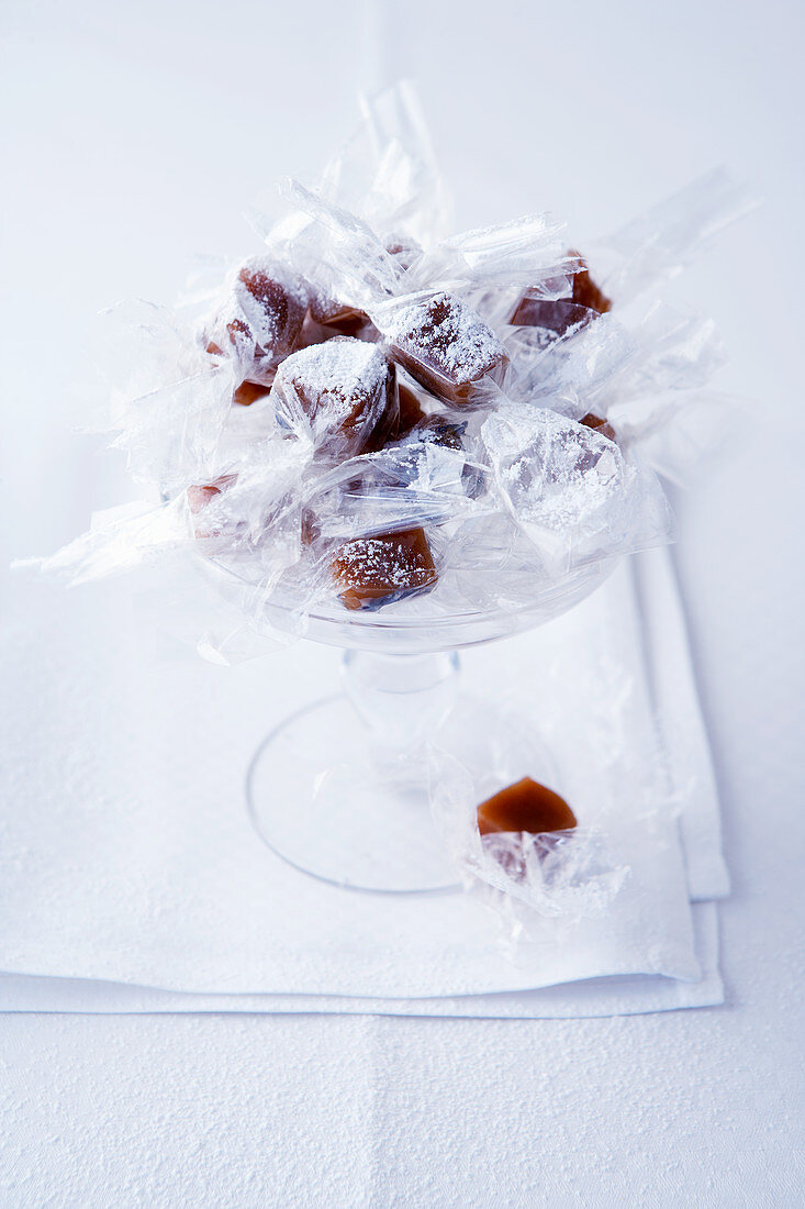 Caramel bonbons with vanilla and lavender wrapped in cellophane