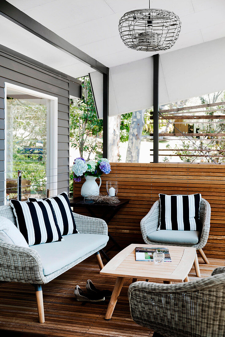 Rattan furniture and coffee table on the covered terrace