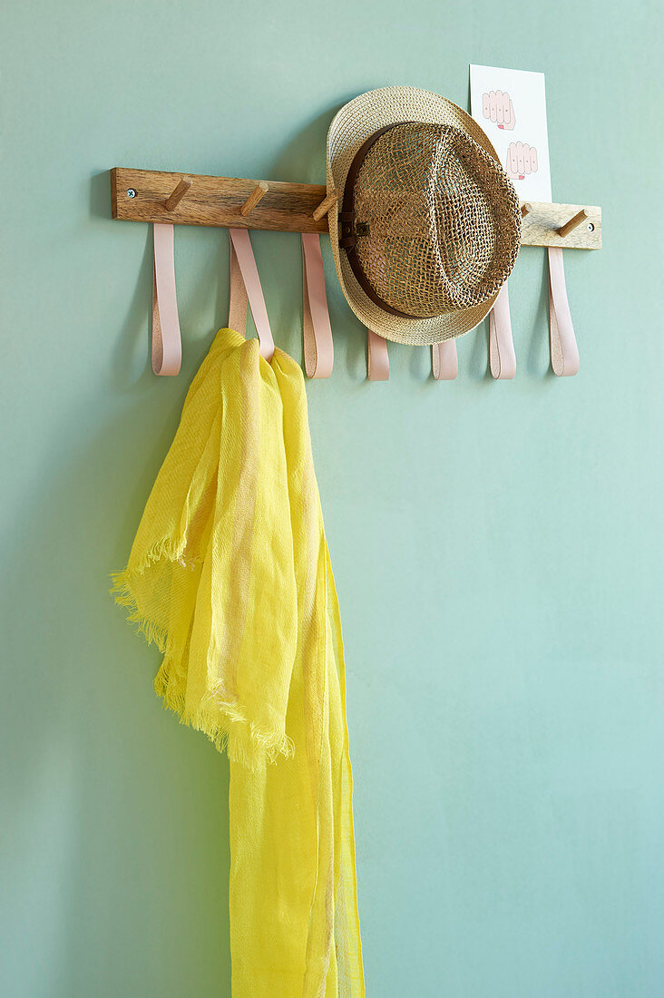 A DIY coat rack with leather loops