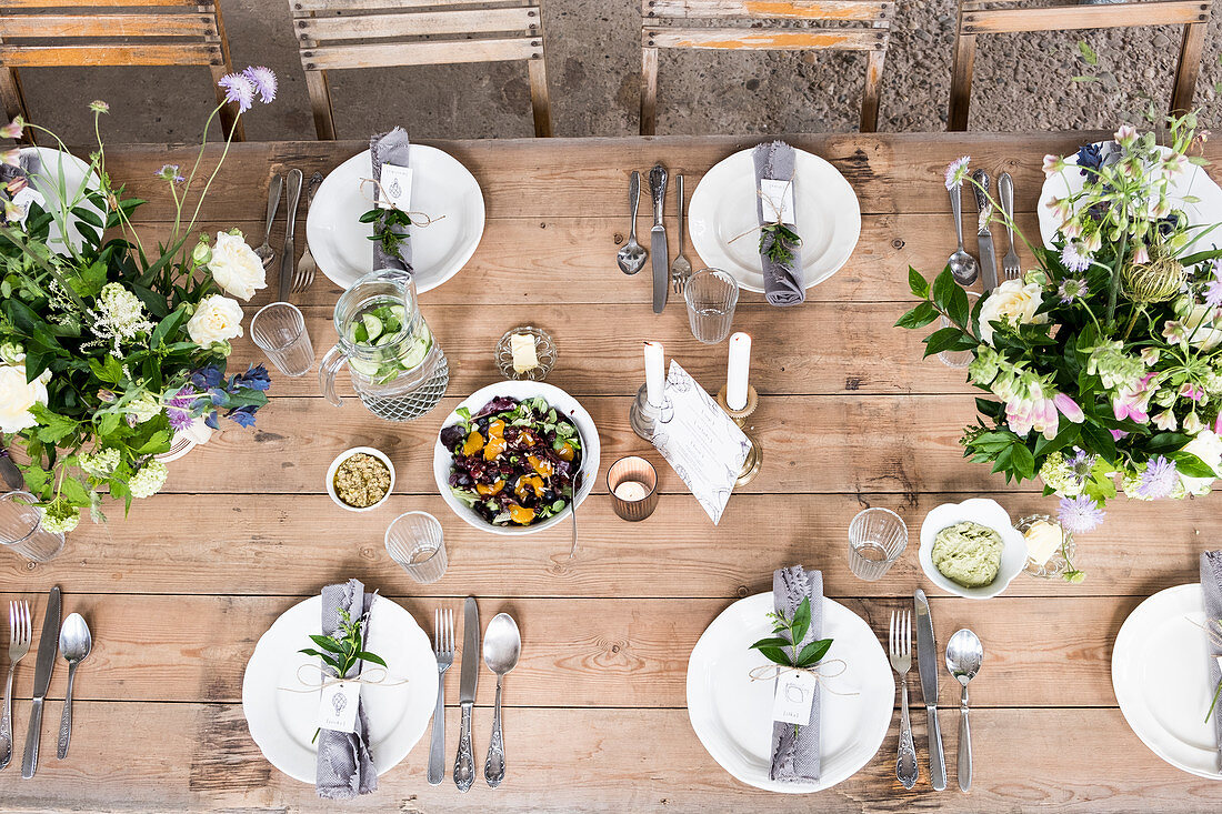 A styled table with flower arrangements