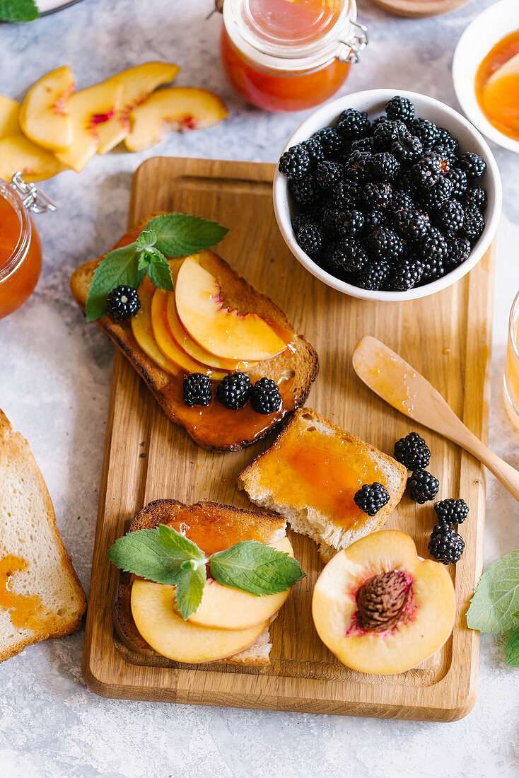 Toasts of bread with apricot jam and fresh fruits