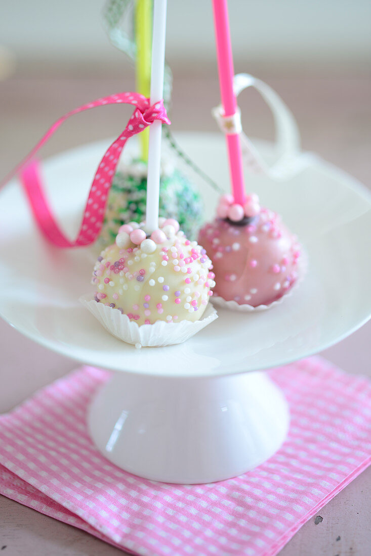 Colourful cake pops decorated with sugar sprinkles