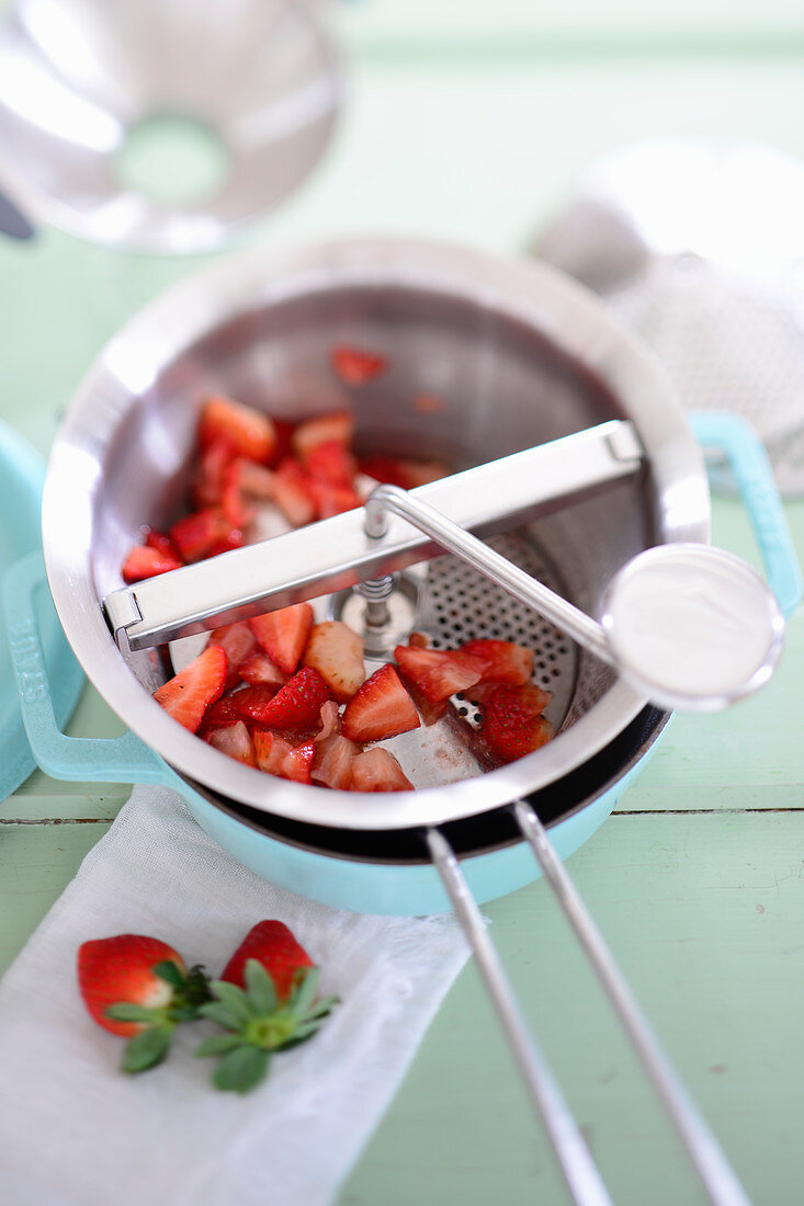 Strawberries being sieved