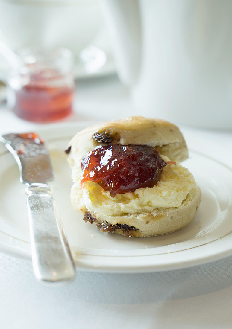 Scone with clotted cream and strawberry jam
