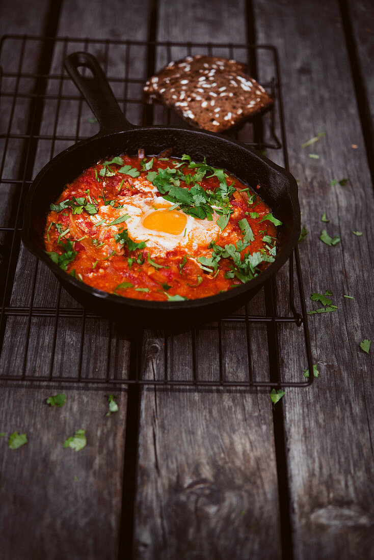 Tomato shakshuka in a pan (egg dish, North Africa)